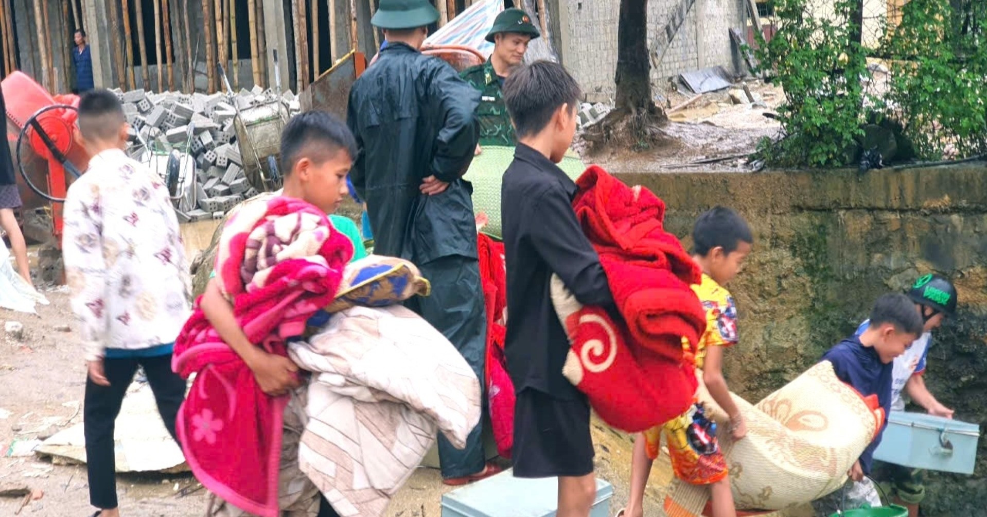 Large block of earth and rock slides down to dormitory, threatening hundreds of students