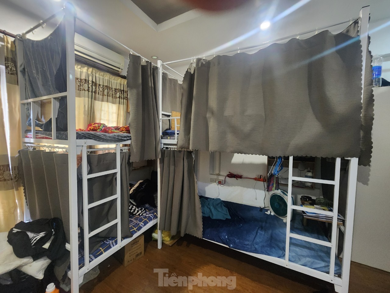 Close-up of a rented room with bunk beds and sleeping boxes at risk of fire and explosion in Hanoi, photo 7