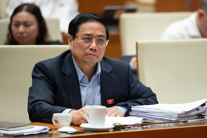 Prime Minister Pham Minh Chinh attends the question-and-answer session on the morning of June 8. Photo: National Assembly Media