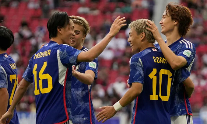 Japan players celebrate Ritsu Doan's opening goal against Bahrain at Al Thumama Stadium in Doha, Qatar, during the 2023 Asian Cup Round of 16 on January 31, 2024. Photo: AP