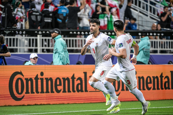 Mehdi Taremi (No. 9) celebrates scoring the opening goal from the penalty spot for Iran against Syria. Photo: AFC