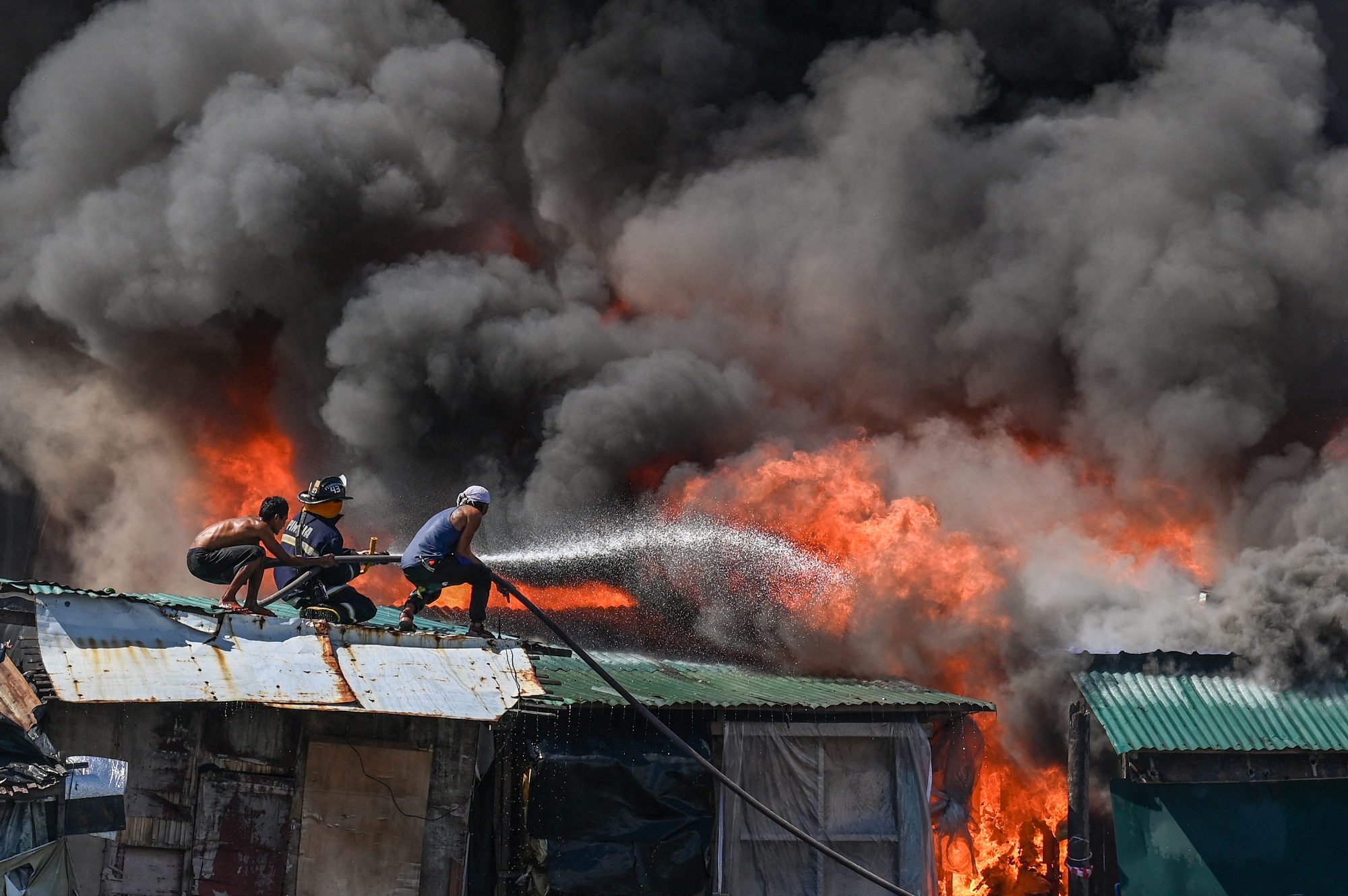 Cháy khu ổ chuột ở Philippines, 1.000 ngôi nhà bị thiêu rụi- Ảnh 2.