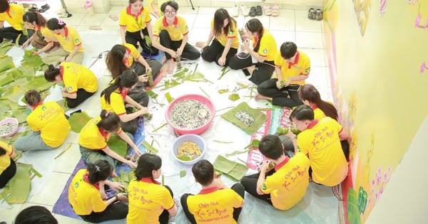 Lao and Cambodian students show off their Banh Tet wrapping skills ahead of Lunar New Year