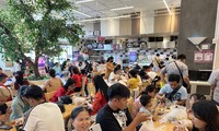 Food stalls at shopping malls are packed on the third day of Tet