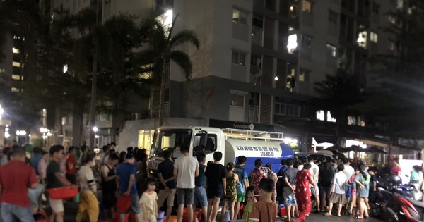 Thousands of residents in Ho Chi Minh City carry buckets and basins to collect water in the middle of the night.