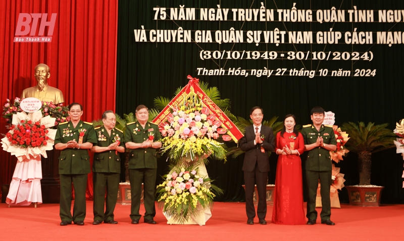 Meeting to celebrate the 75th anniversary of the traditional day of Vietnamese volunteer soldiers and military experts helping the Lao revolution