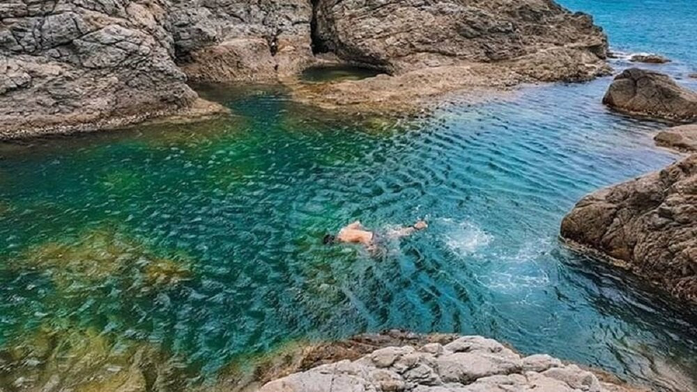 Have fun and swim in the famous natural blue lake of Mui Nghe.