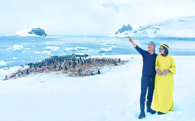 Mme Xuan Hong et M. Nguyen Hieu portent des costumes traditionnels vietnamiens en Antarctique.