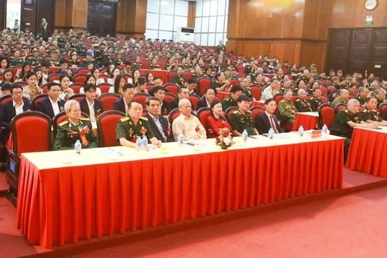 Meeting to celebrate the 75th anniversary of the traditional day of Vietnamese volunteer soldiers and military experts helping the Lao revolution