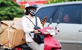 What is the penalty for using a phone while driving a motorbike?