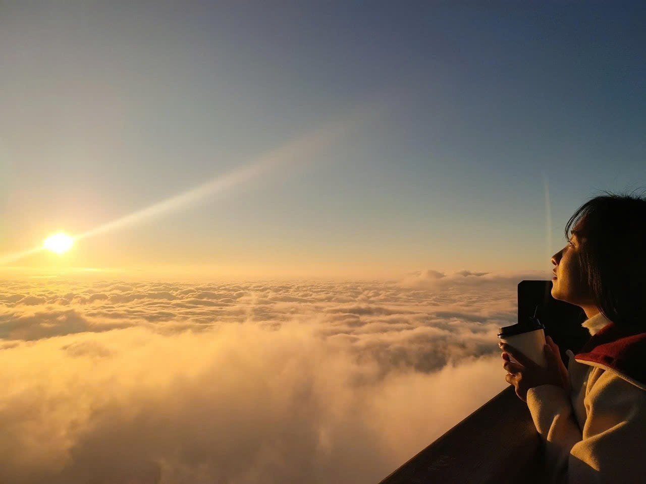 Tourists enjoy the beautiful scenery among the clouds on top of Fansipan.