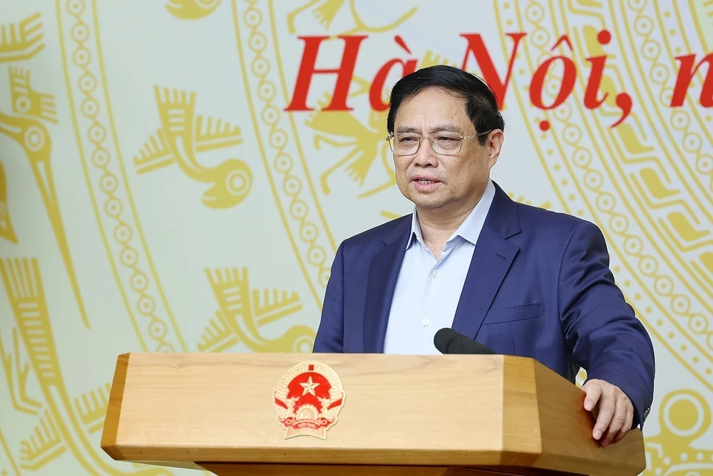 Premierminister Pham Minh Chinh sprach bei einer Arbeitssitzung mit dem State Capital Management Committee bei Unternehmen und 19 Konzernen und allgemeinen Unternehmen. (Foto: Duong Giang/VNA)