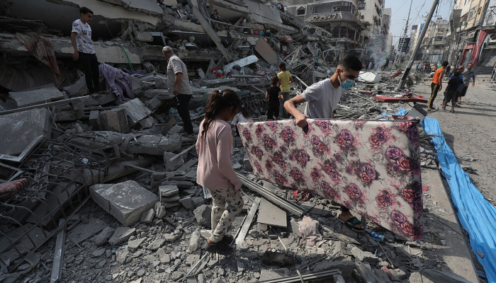 Gaza residents agonize as they dig through the rubble to find bodies of loved ones