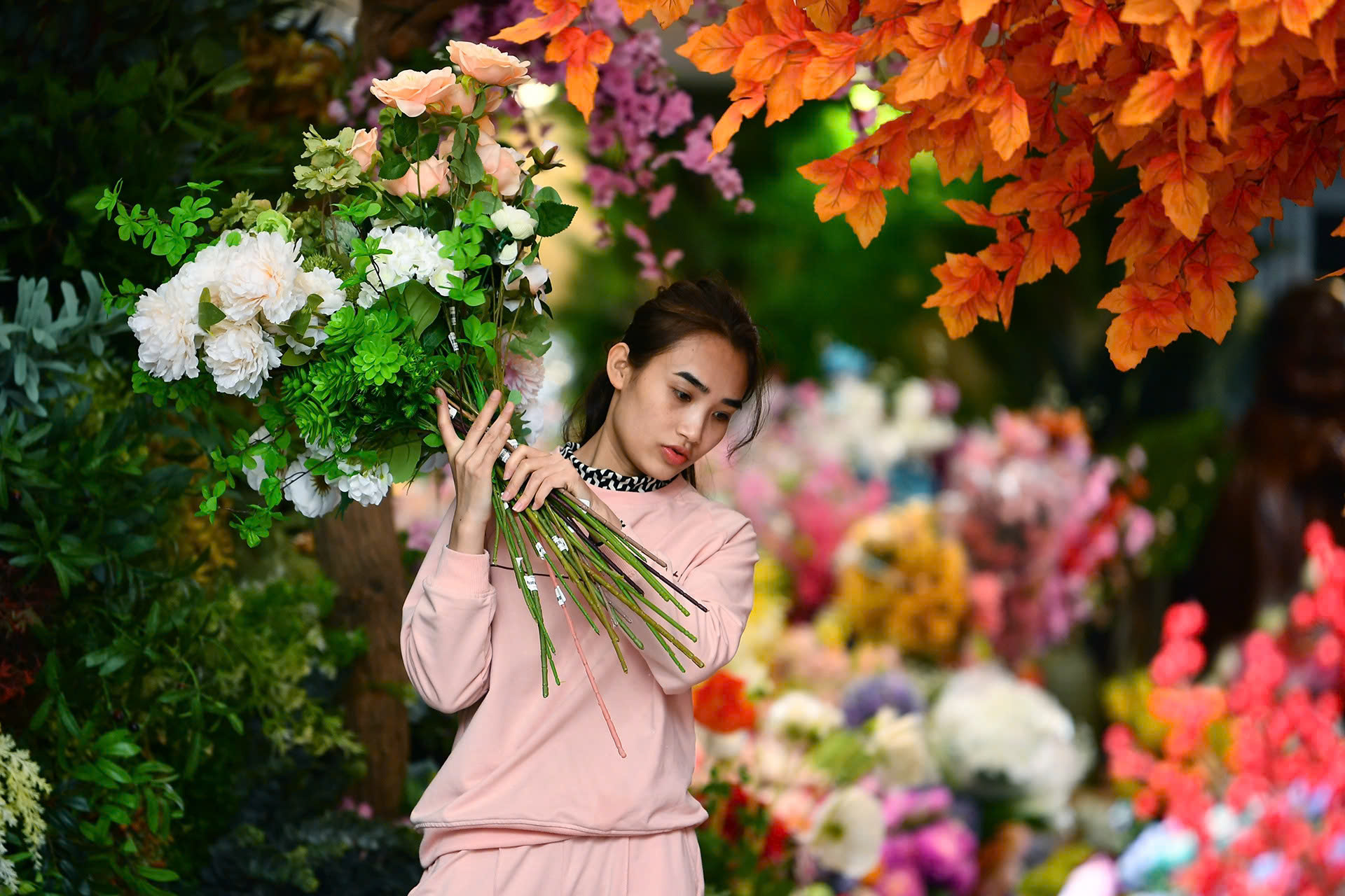 Take a walk around the colorful Tet flower market in Hanoi's Old Quarter