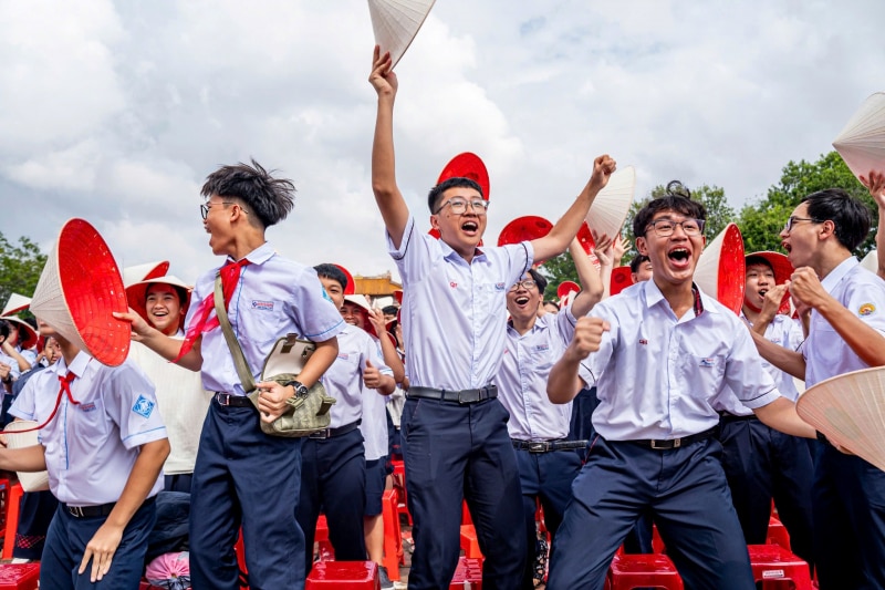 Thousands of students in the ancient capital of Hue wear conical hats to cheer for 