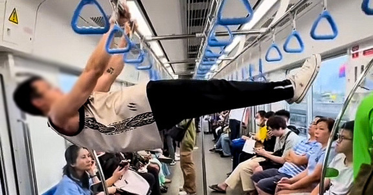 Young man doing chin-ups on metro number 1: Offensive, unsafe