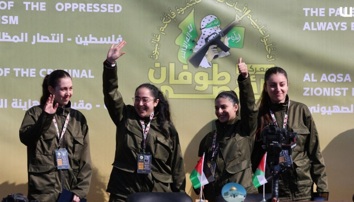 Photos and videos of Hamas holding an event to release 4 female Israeli hostages in Gaza