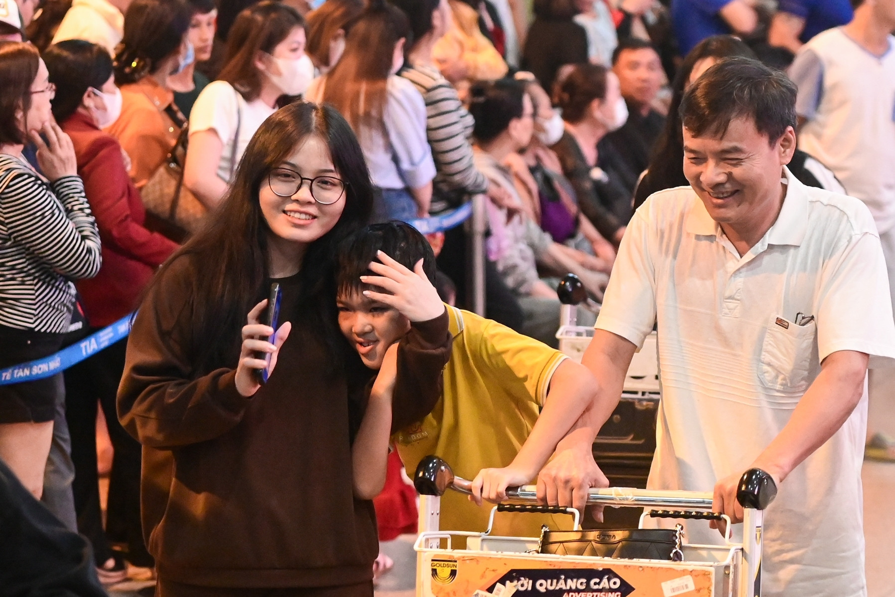 Tan Son Nhat Airport is crowded with people welcoming overseas Vietnamese home for Tet.