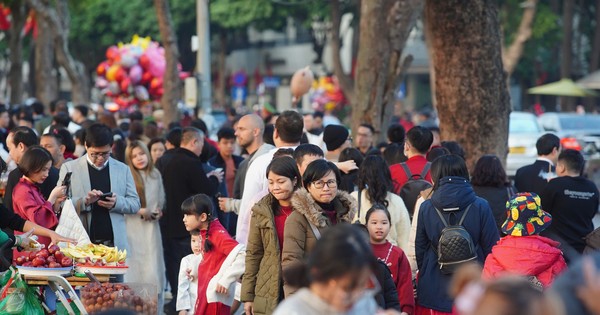 Hoan Kiem Lake is crowded on the second day of Tet.