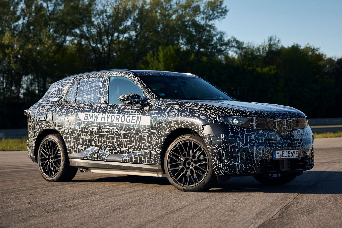 The BMW iX5 Hydrogen on the test track demonstrates BMW's commitment to fuel cell technology.