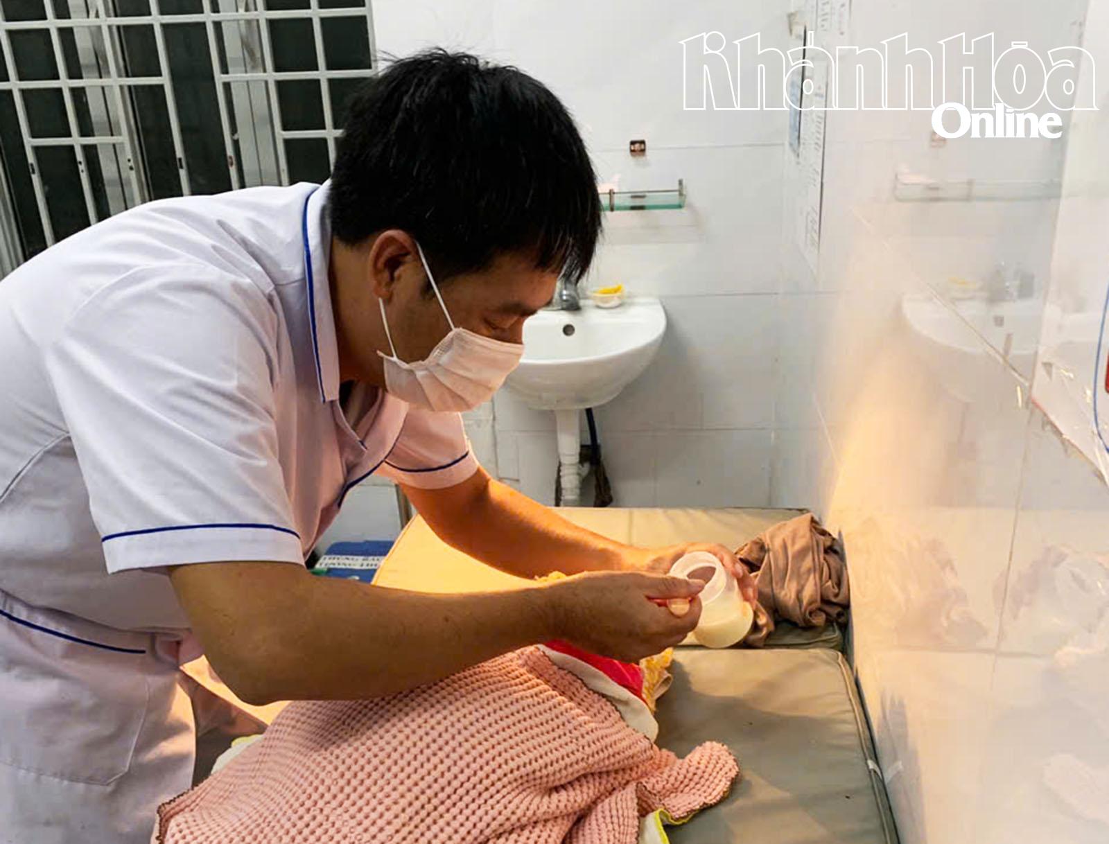 Abandoned newborn baby girl is cared for by medical staff at the health station.