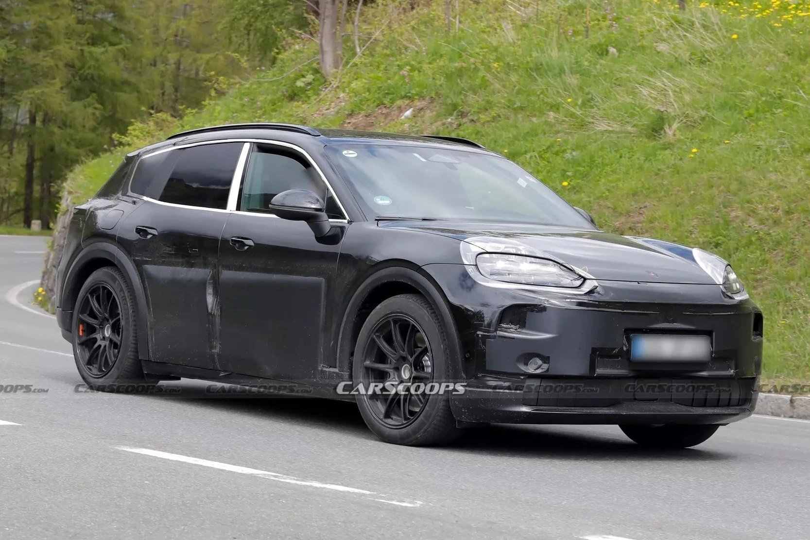 Image of an electric Porsche Cayenne being tested.