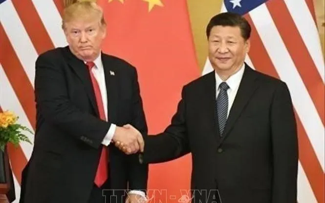 Chủ tịch Trung Quốc Tập Cận Bình (phải) và Tổng thống Mỹ Donald Trump. Ảnh: Kyodo/TTXVN
