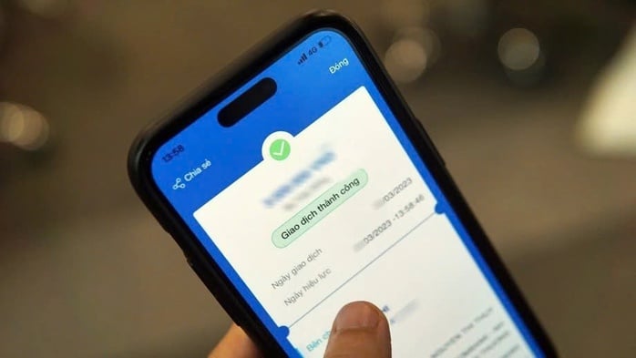 Wie moet overschrijvingen van 500 miljoen VND of meer melden? - Foto 1. Ai phải báo cáo chuyển khoản từ 500 triệu đồng? - Ảnh 1.