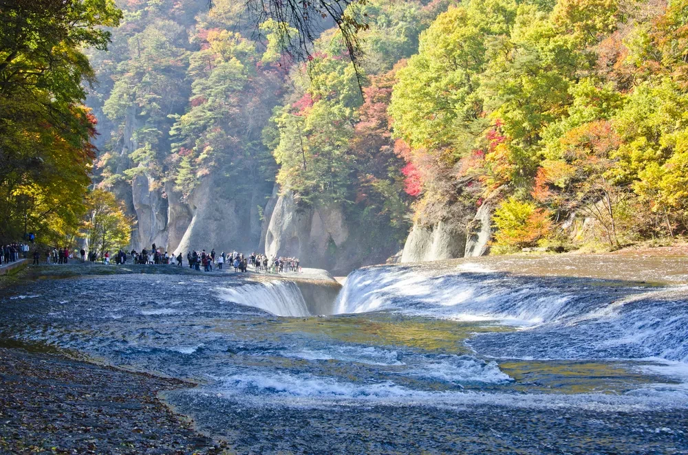 Panoramic view of the majestic Fukiware Falls with water pouring down the gorge.