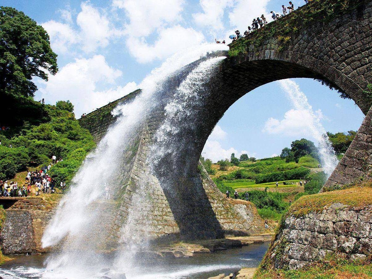 Tsujunkyo stone bridge is releasing water to create two artificial waterfalls.