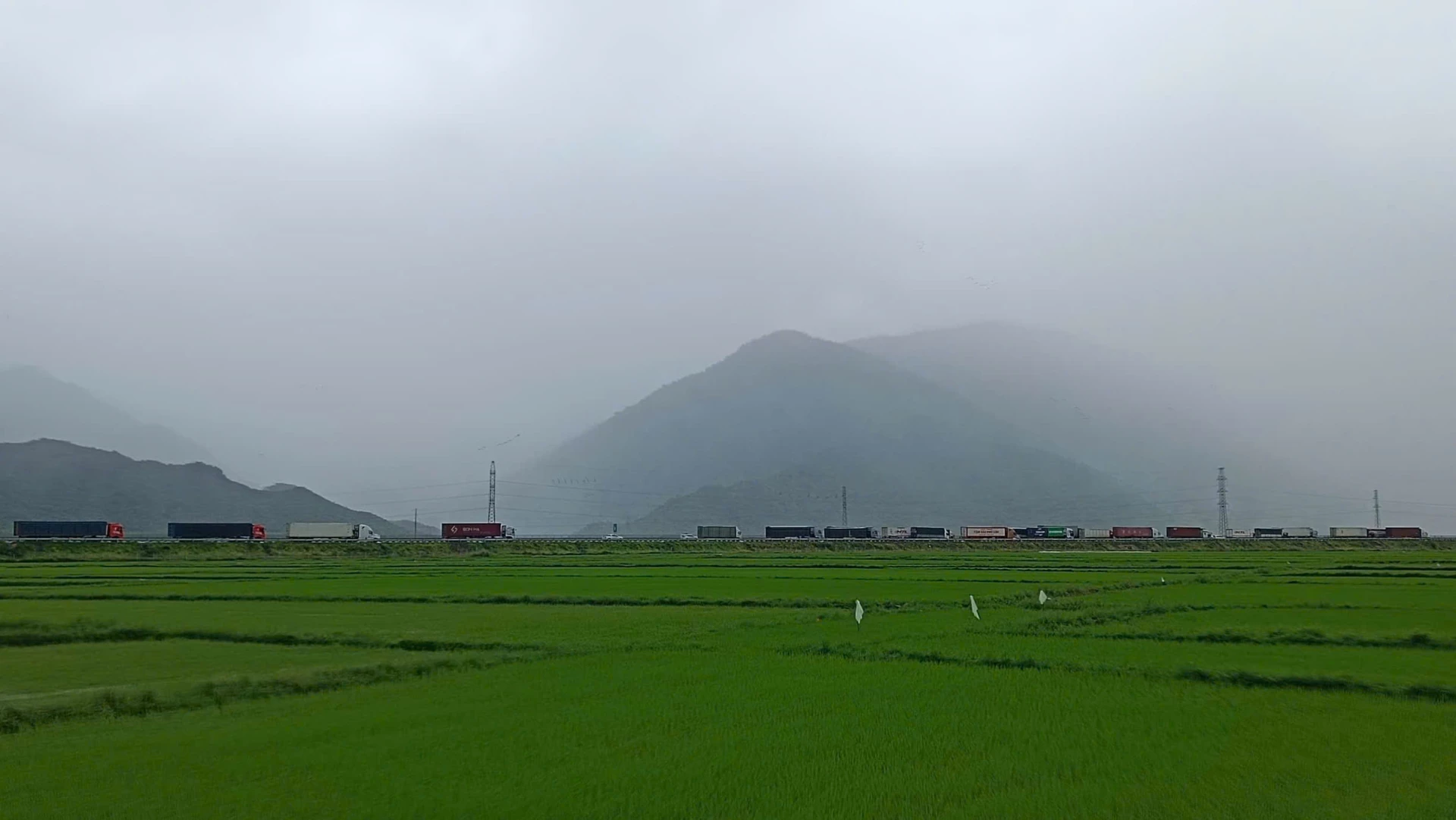 A convoy of vehicles on National Highway 1 through the Van Ninh area