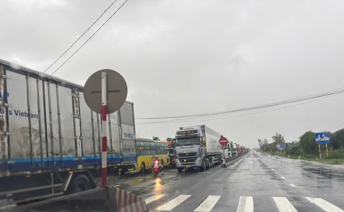 National Highway 1 is congested, waiting for the water to recede.