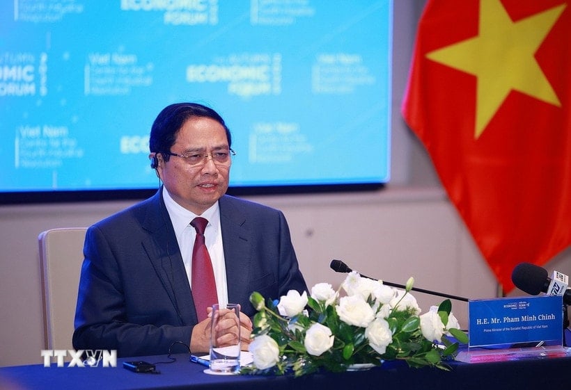 Premier Pham Minh Chinh ontvangt internationale bedrijven uit de financiële sector. (Foto: Duong Giang/VNA)