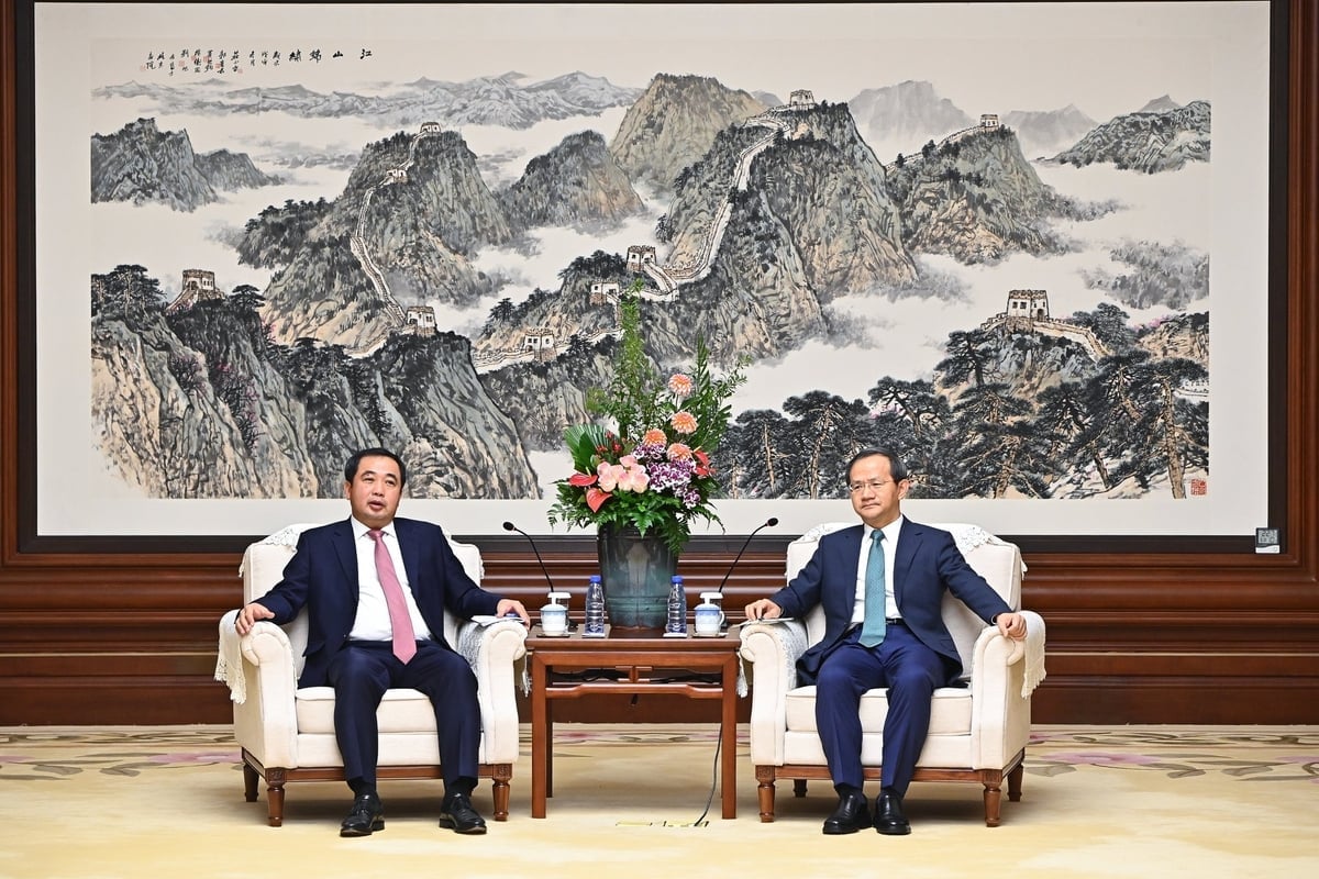 Bộ trưởng Trần Đức Thắng làm việc với Thị trưởng Bắc Kinh Ân Dũng chiều 27/11. Ảnh: Tùng Đinh.