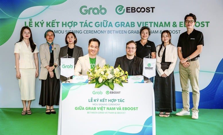 Grab hợp tác EBOOST mở rộng sử dụng xe điện tại Việt Nam- Ảnh 1.