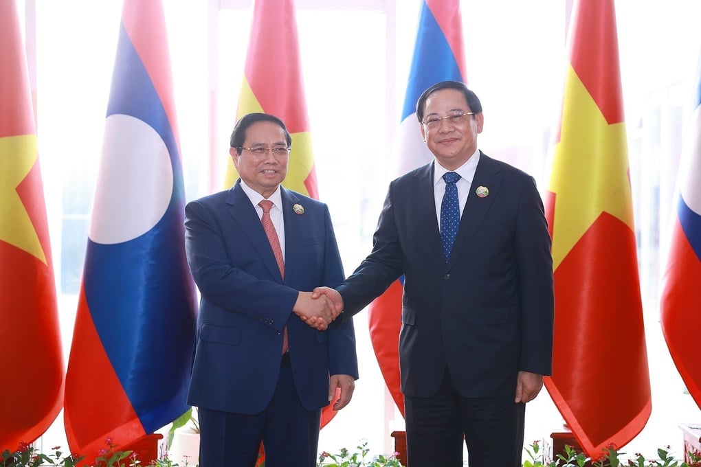 Perdana Menteri Vietnam dan Laos bersama-sama memimpin Konferensi Promosi Investasi - 1
