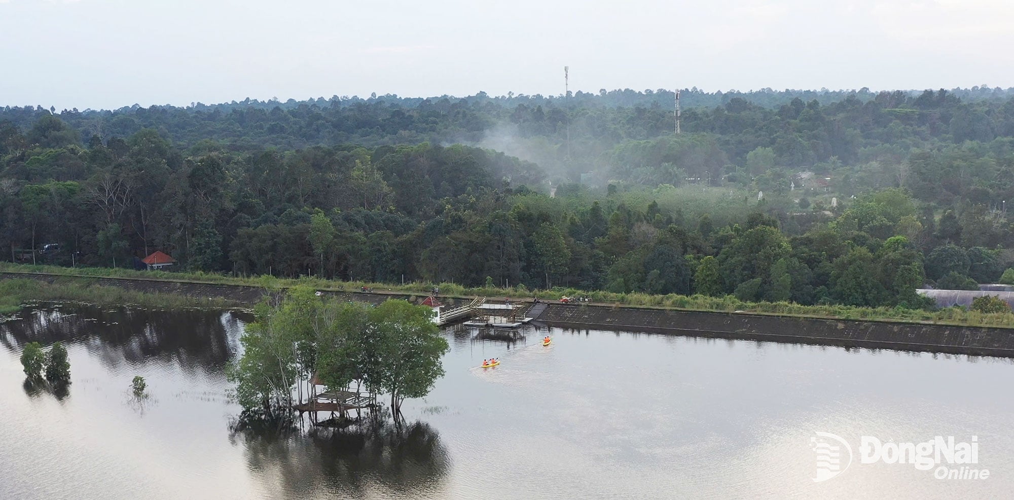 A peaceful corner of Ba Hao Lake, the calm water reflects the green forest. Photo: Tien Dung 