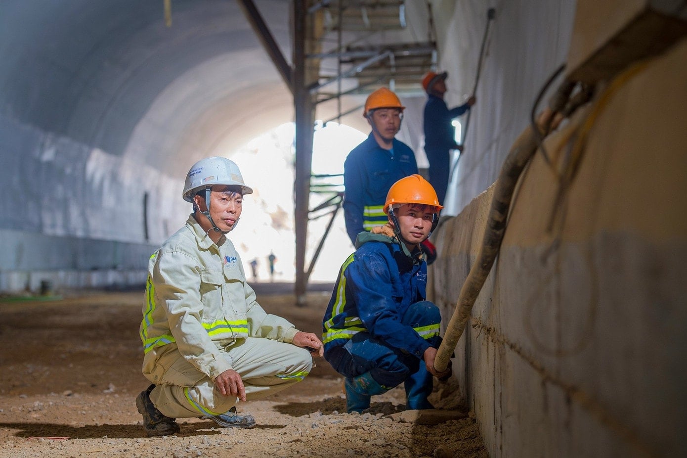 Construction workers are working at the That Khe tunnel, one of the two tunnels through the mountain in the project.