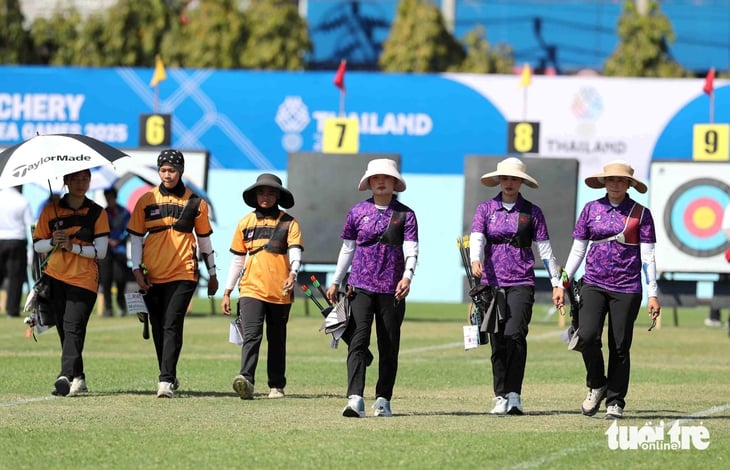 Đứng bắn giữa nắng chiều 32 độ C, cung thủ Việt Nam vào tranh HCV - Ảnh 9.