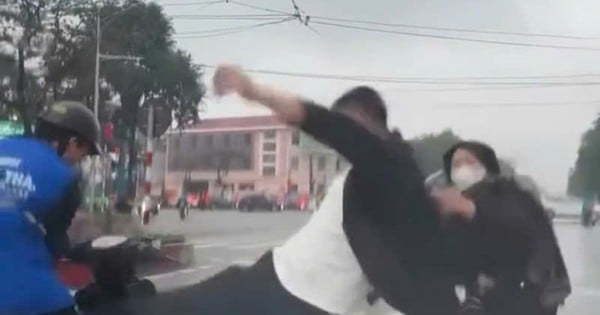 Stirring clip of young man being beaten by man in the middle of the street