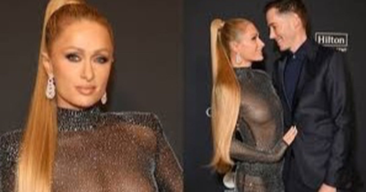 Paris Hilton porte une robe transparente et marche avec son mari sur le tapis rouge