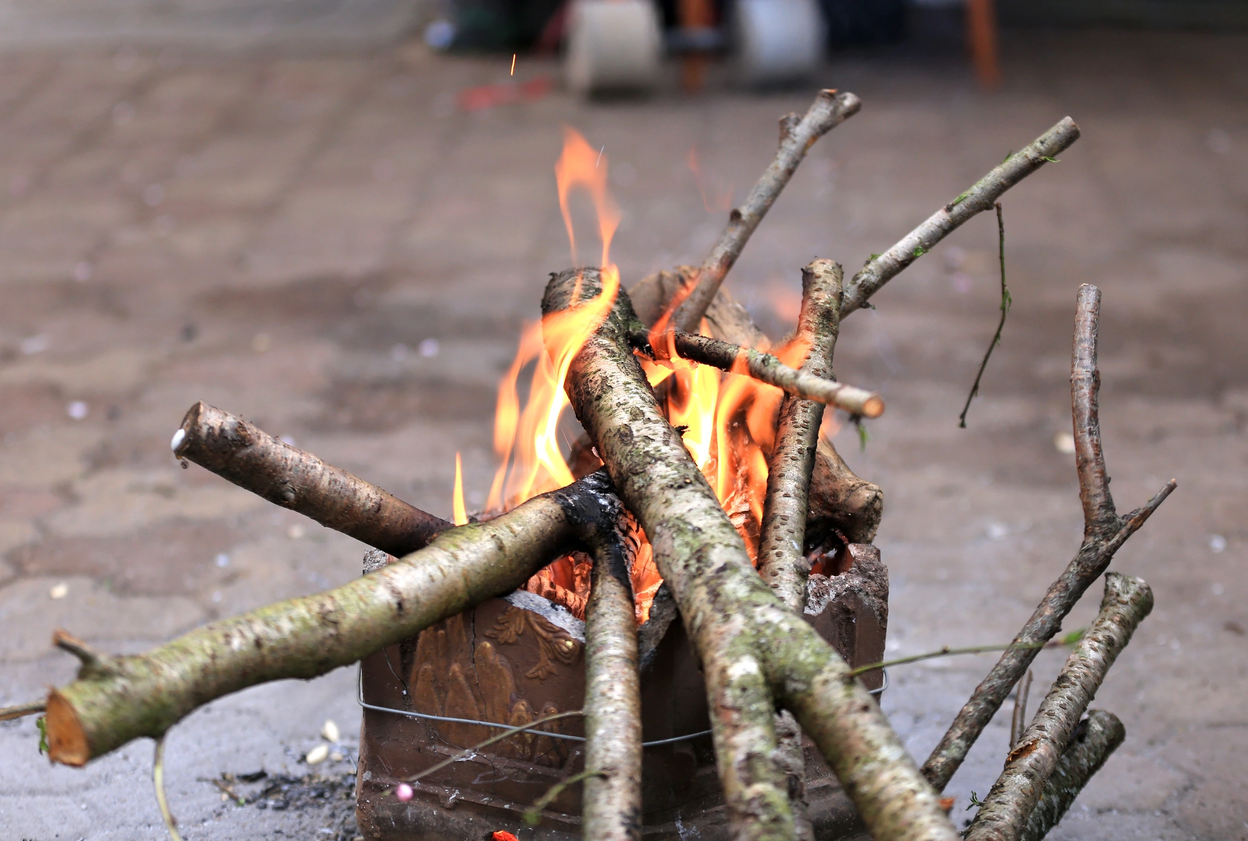 Hanoians light fires during the day to keep warm in the 10 degree Celsius cold