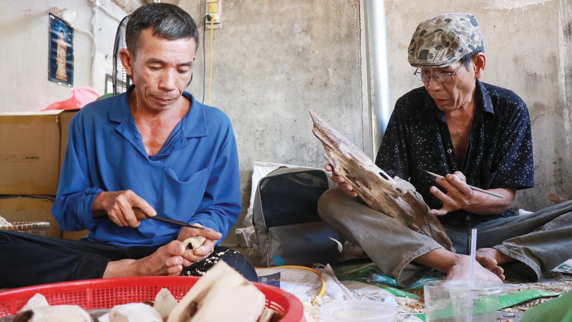 Mr. Le Long (right) is a long-time artisan of the village.