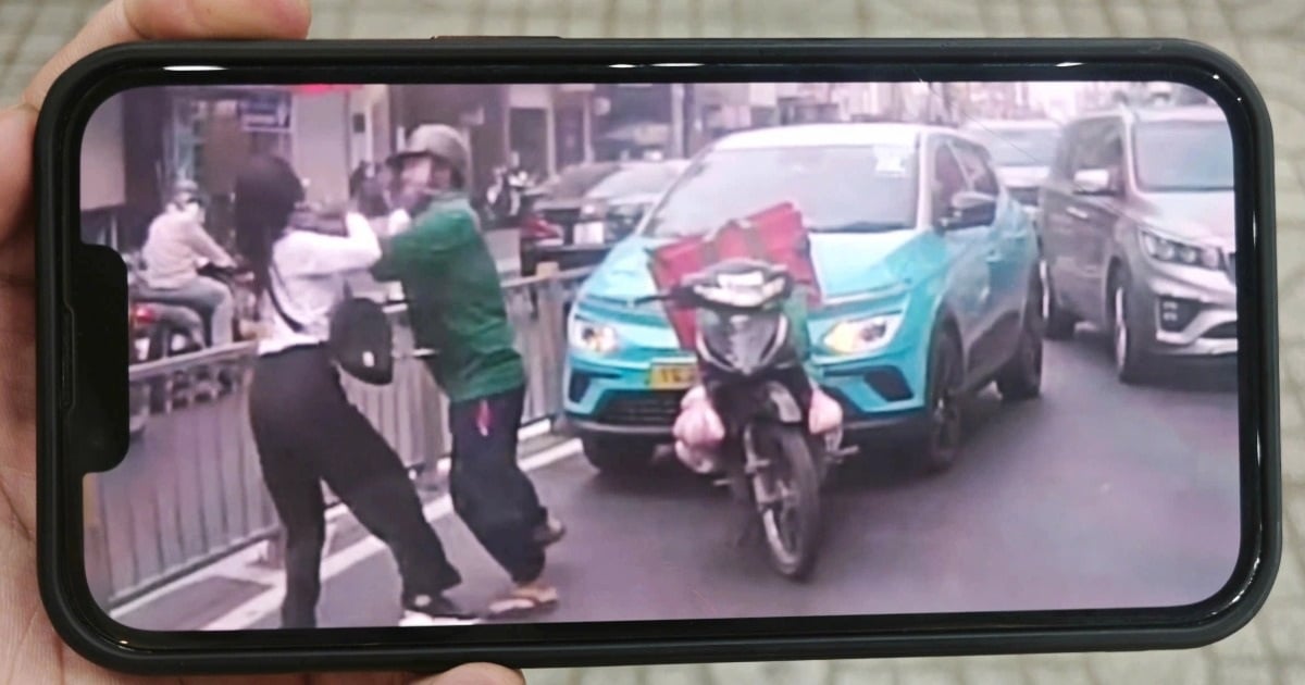 Mann und Taxifahrerin streiten mitten auf der Straße in Ho-Chi-Minh-Stadt