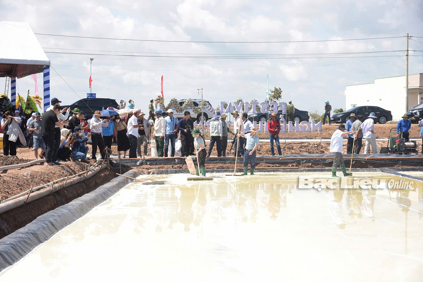 Tourists enjoy the experience of making salt.