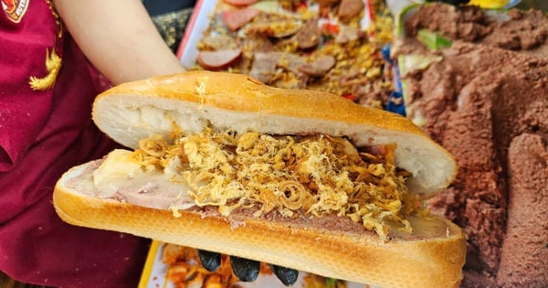 Customers stand in line in the sun at noon to buy bread at a festival in Ho Chi Minh City.