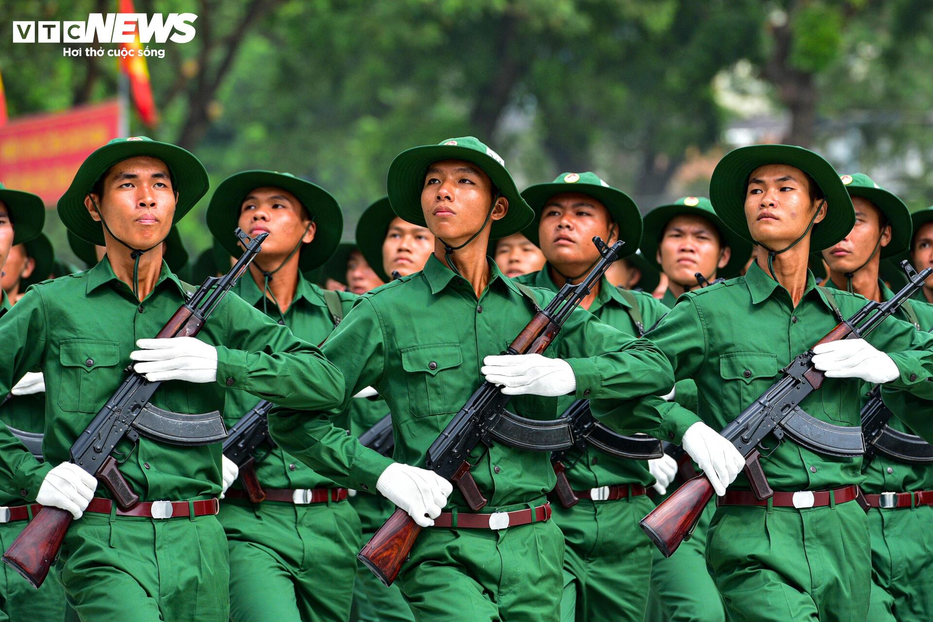 Soldiers practice in the sun for the parade to celebrate the 50th anniversary of the Liberation of the South