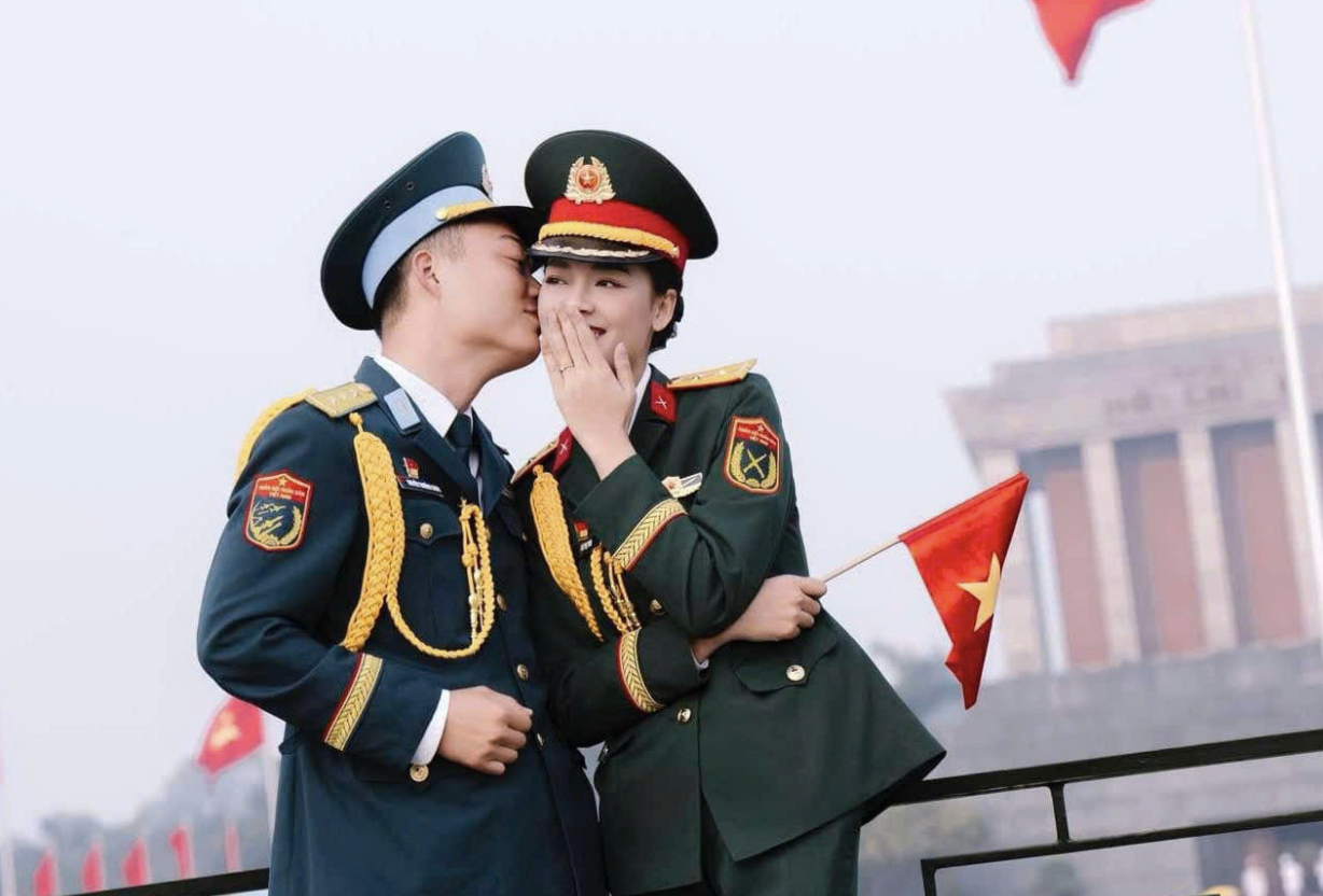 Military officer and his wife march together to celebrate 50 years of national reunification