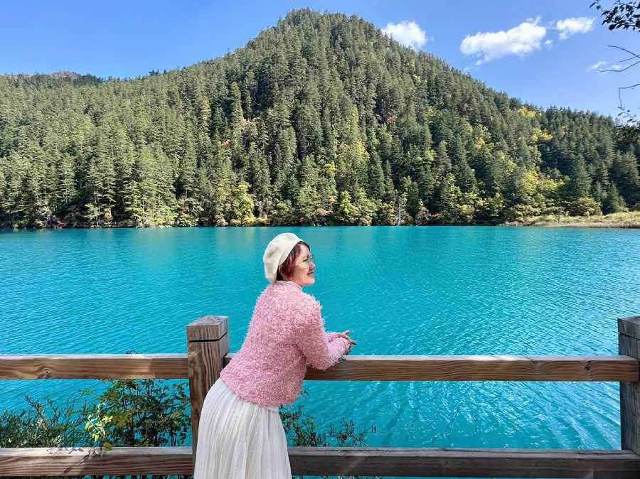 Tourists enjoy being creative while standing by the lake.jpg