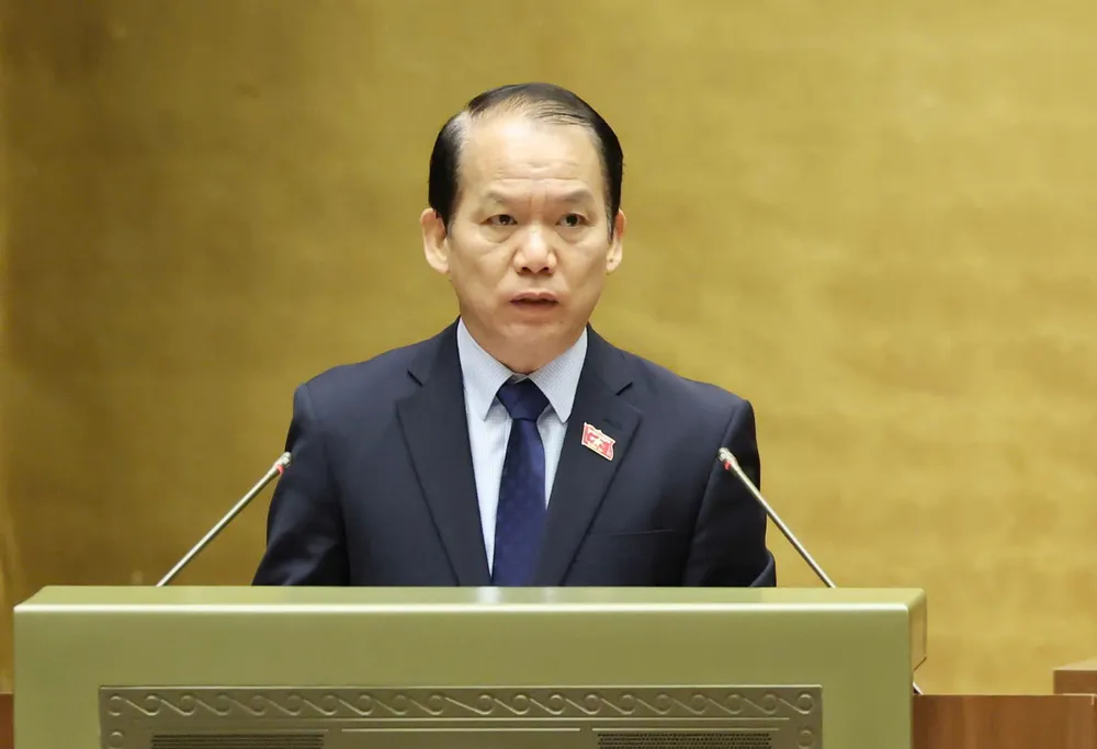 Chủ nhiệm Ủy ban Pháp luật và Tư pháp của Quốc hội Phan Văn Mãi trình bày báo cáo thẩm tra dự án Luật sửa đổi, bổ sung một số điều của Luật Quốc tịch Việt Nam.jpg